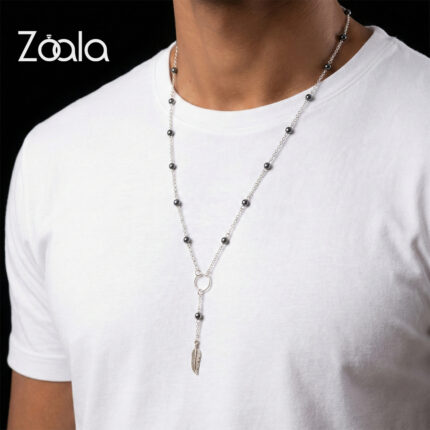 Silver 925 and hematite stones coming together in this hand made piece with a feather pendant